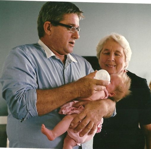 Eldest son John with his 1st grandchild while Margaret looks on