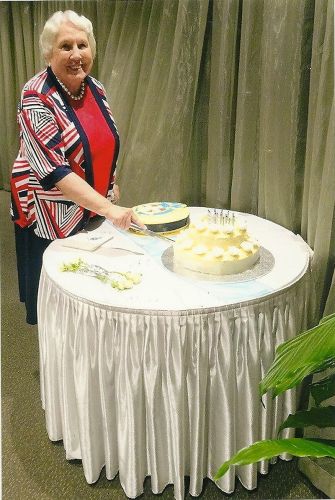 Margaret cuts her 80th birthday cake